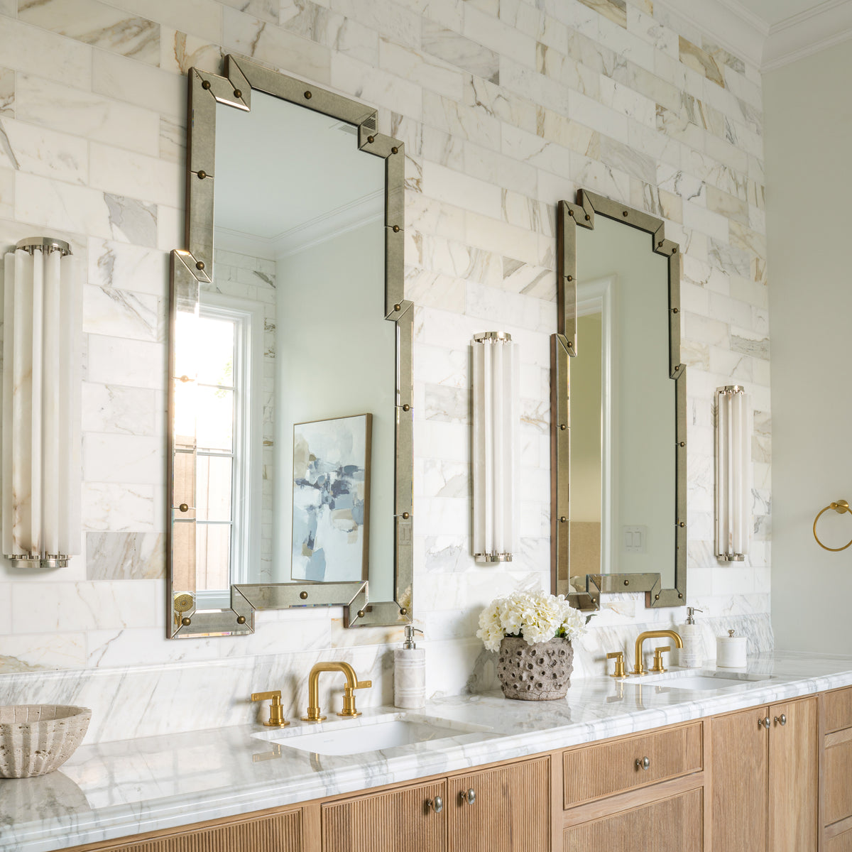 calacatta gold subway tile installed on the wall of a bathroom