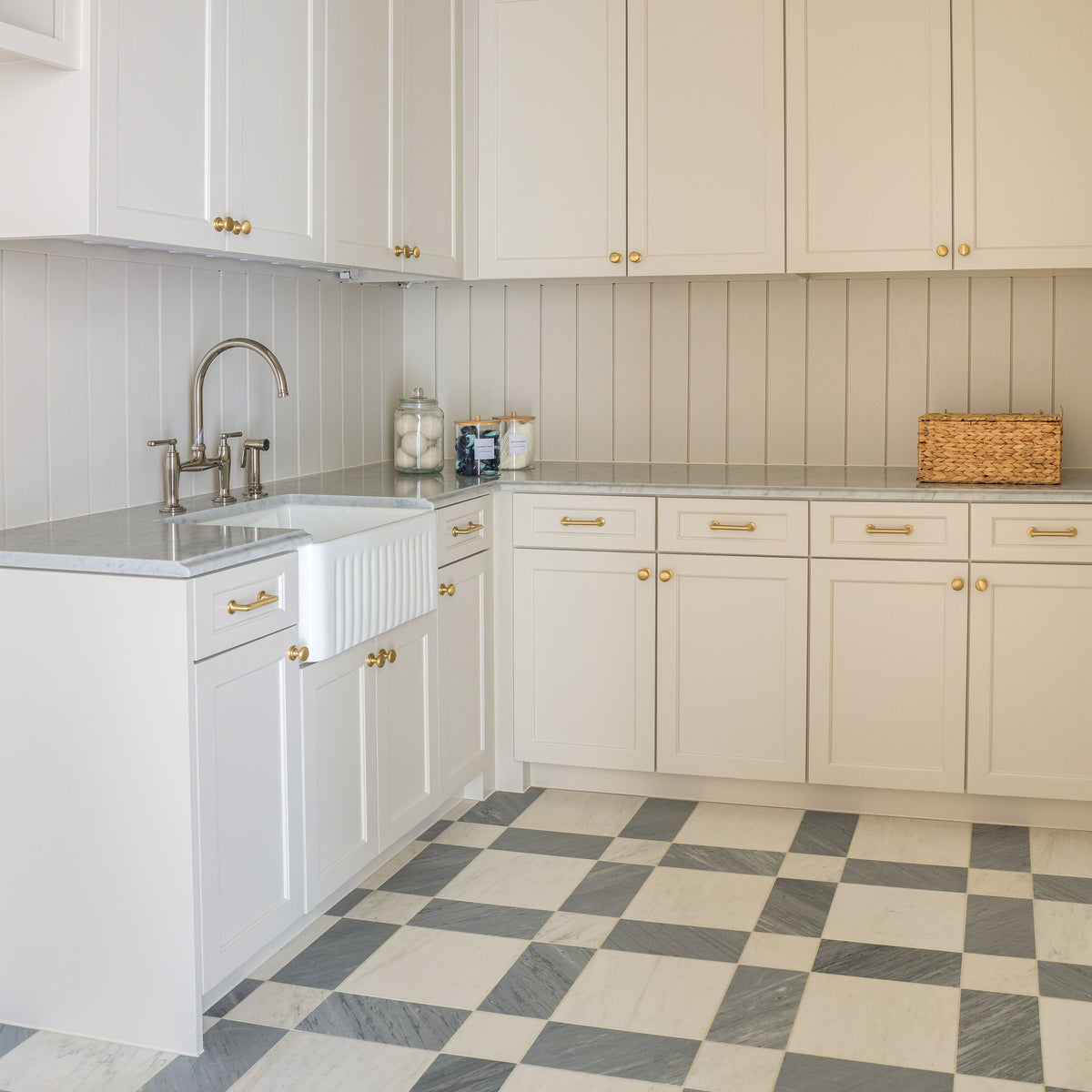 white and grey marble pattern installed on the floor in laundry room