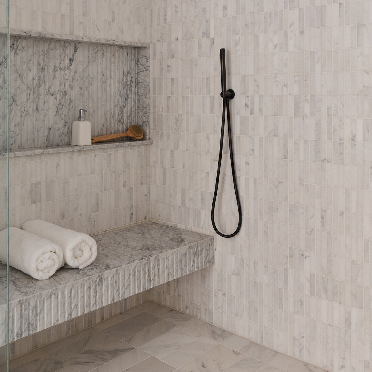 casablanca carrara rectangle stacked marble in shower
