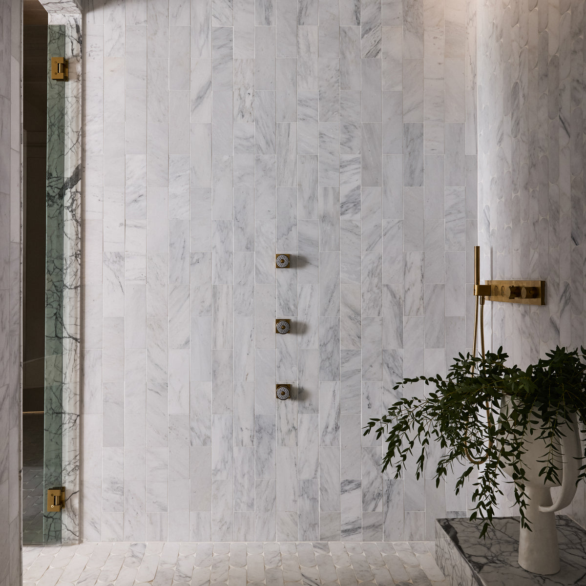 casablanca carrara rectangle marble tile installed on wall in shower