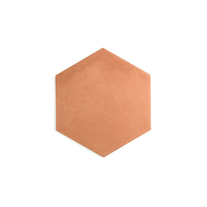 Hexagonal brown cork board on a white background