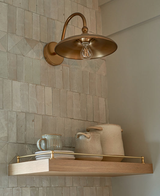 zellige tile backsplash in kitchen with brass sconce
