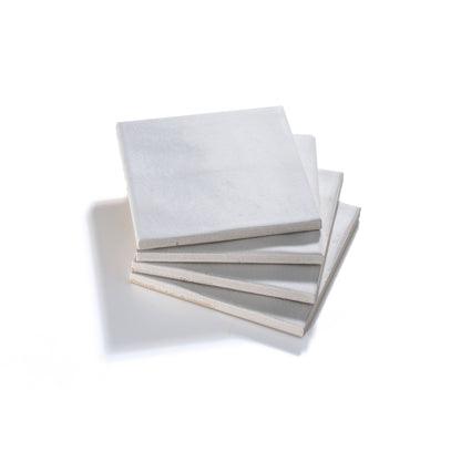 White ceramic floor tile with polished finish