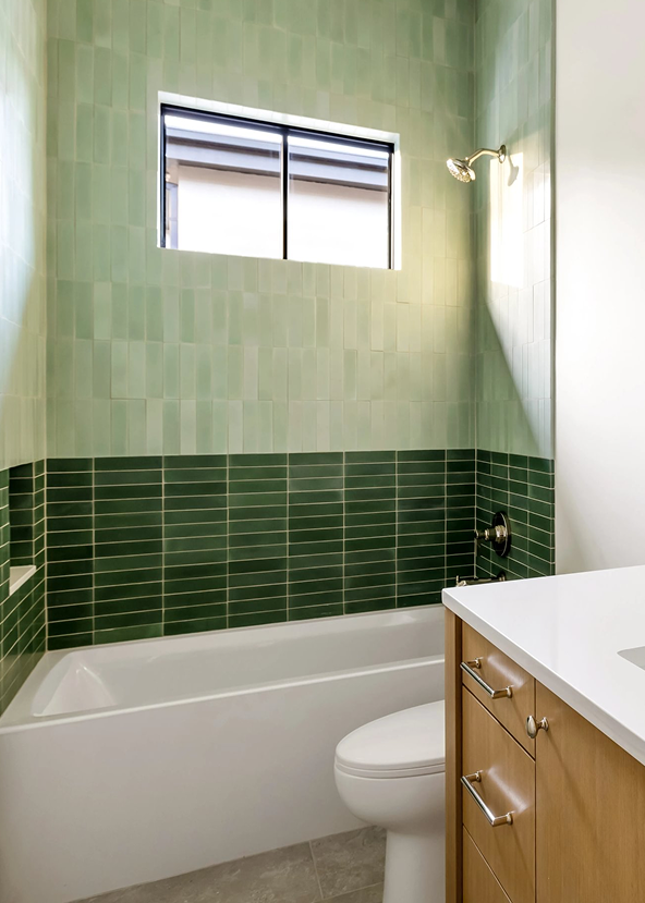 cement green tile installed in color block pattern in shower