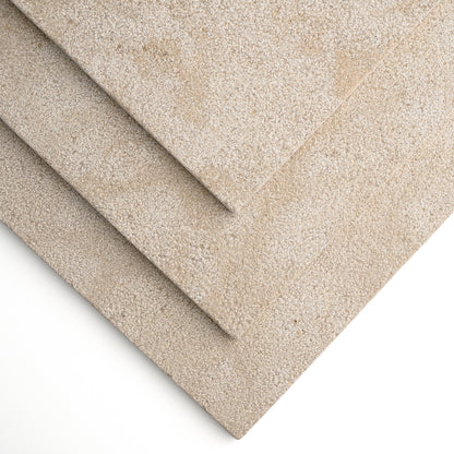 Three overlapping rectangular limestone tile in a warm light beige/taupe, shown on a clean white background.