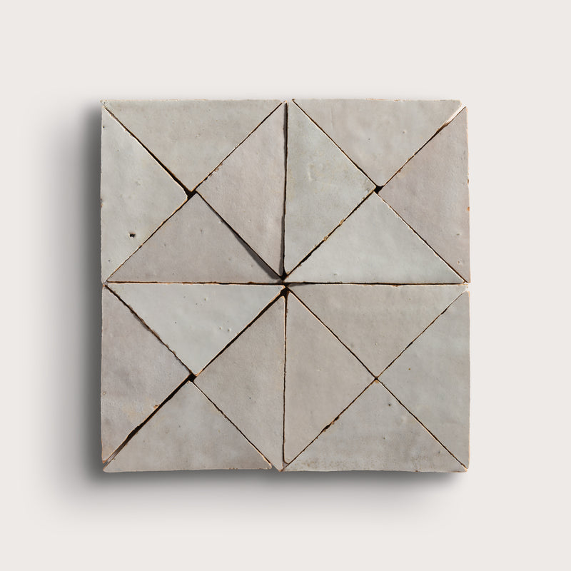 natural white mosaic triangle zellige tile on a light grey background