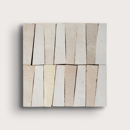 white trapezoid zellige tile on a light gray background