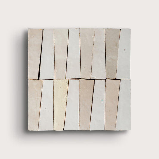 white trapezoid zellige tile on a light gray background