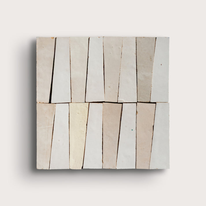 white trapezoid zellige tile on a light gray background