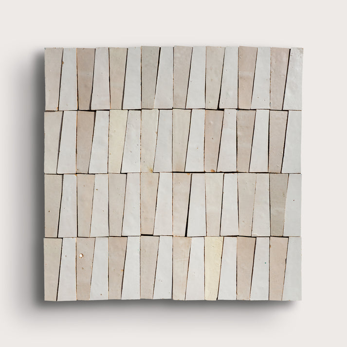 white trapezoid zellige tile on a light gray background