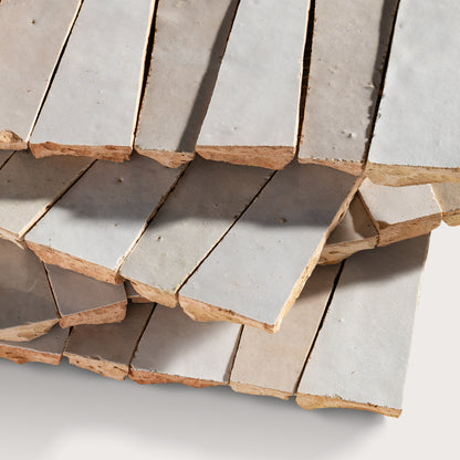 Close-up of zellige tiles with a focus on texture and color variation.
