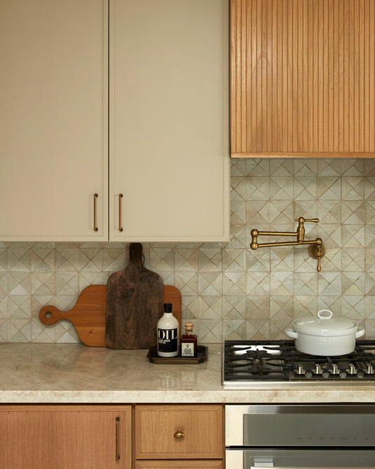 triangle mosaic zellige tile installed as backsplash in kitchen