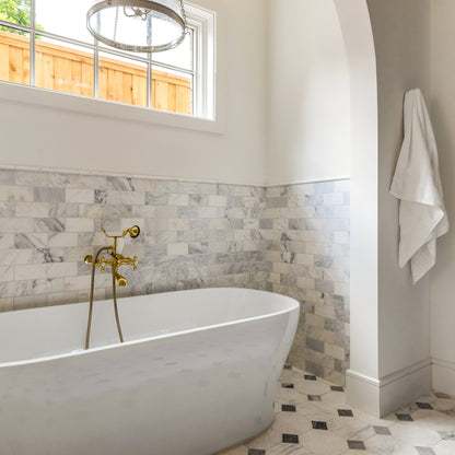white and grey marble in an octagon checkerboard pattern on the floor of a bathroom