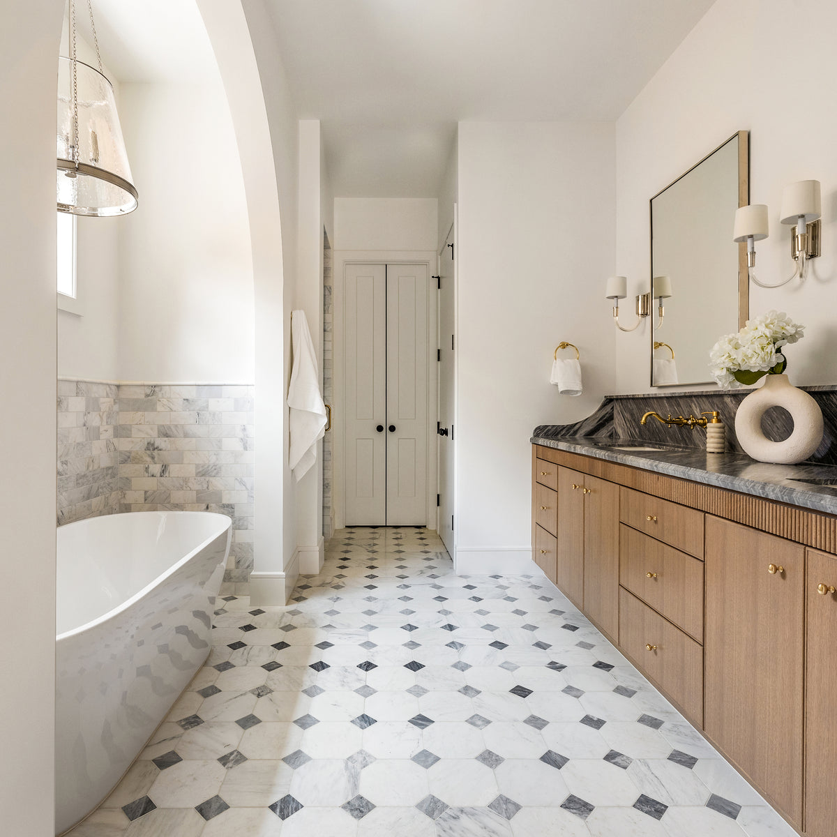 white and grey marble in an octagon checkerboard pattern on the floor of a bathroom