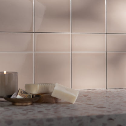 beige square & rectangle ceramic gloss tile installed as backsplash