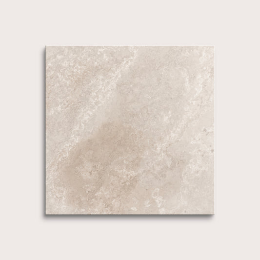Beige limestone tile on a light gray background