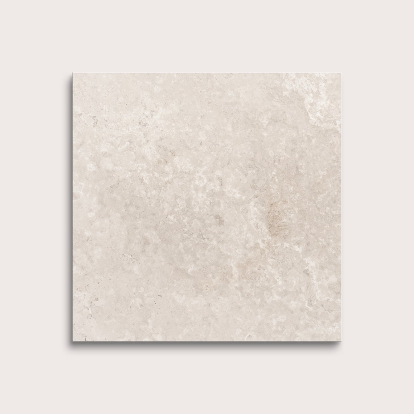 Beige limestone tile on a light gray background