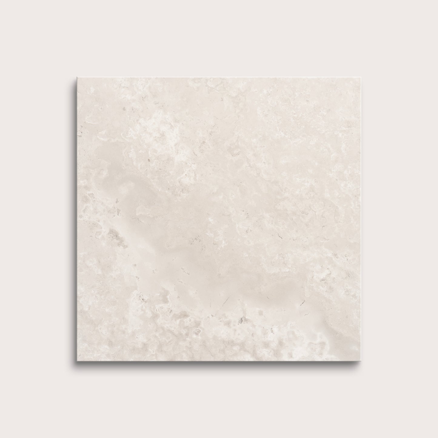 Beige limestone tile on a light gray background