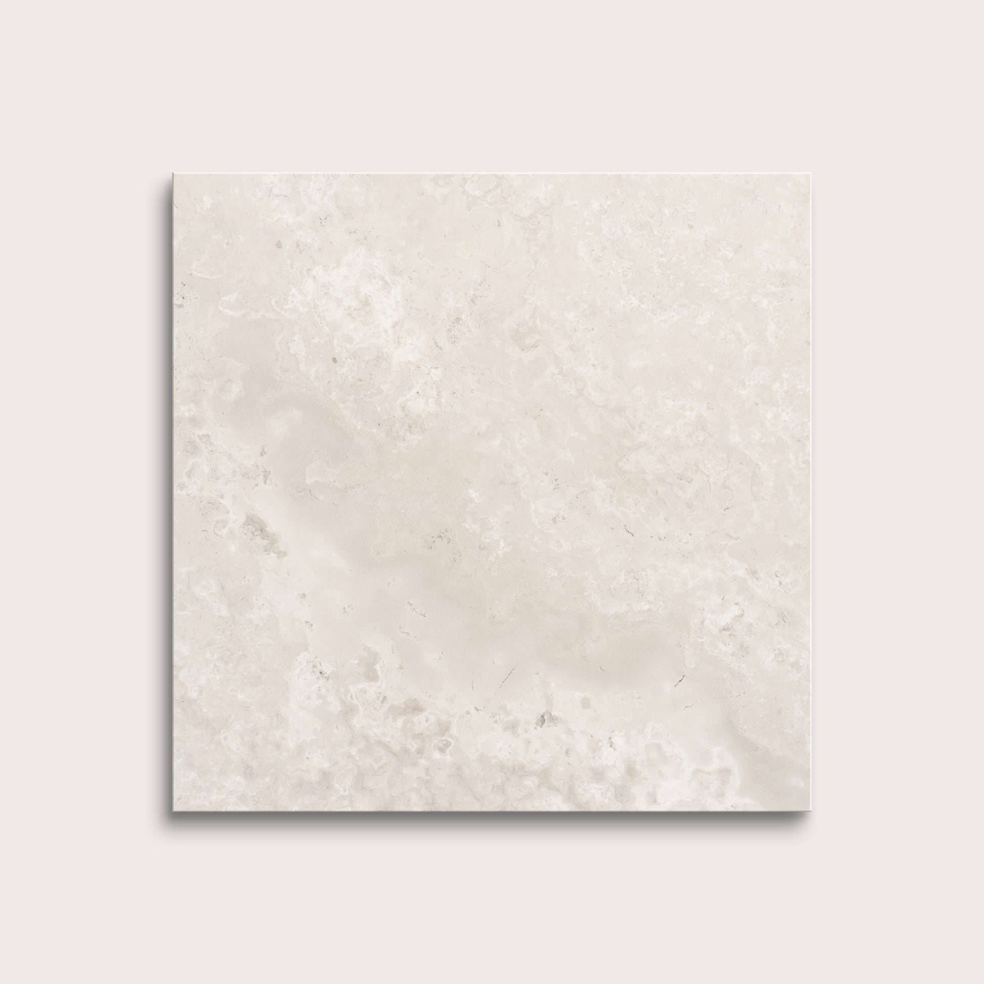 Beige limestone tile on a light gray background
