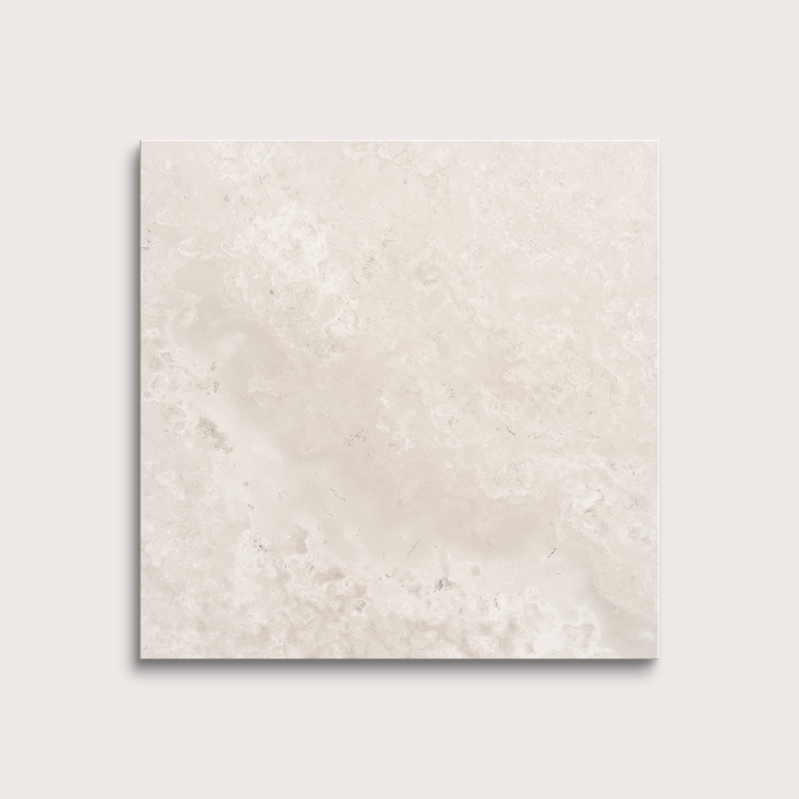 Beige limestone tile on a light gray background
