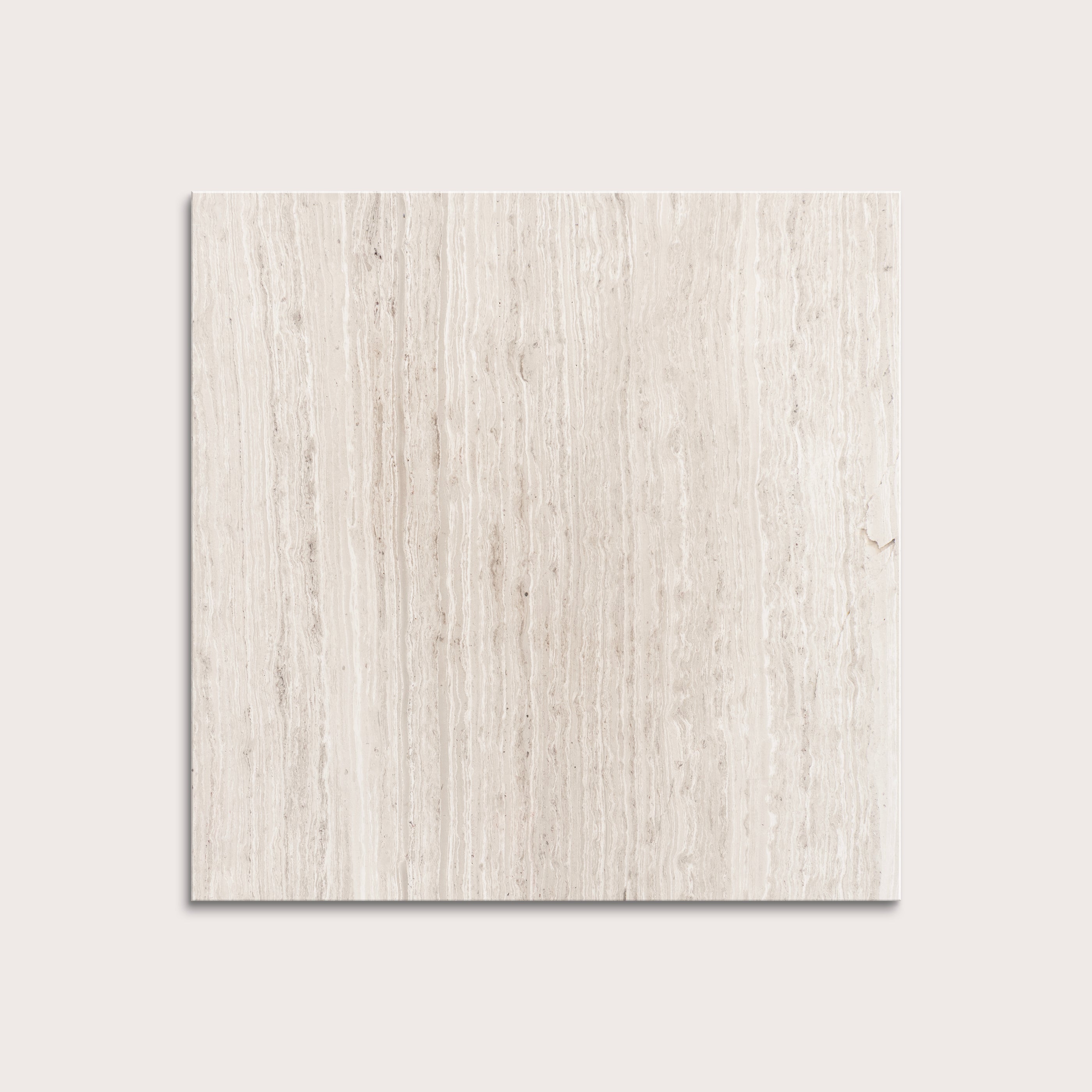 Beige limestone tile on a light gray background