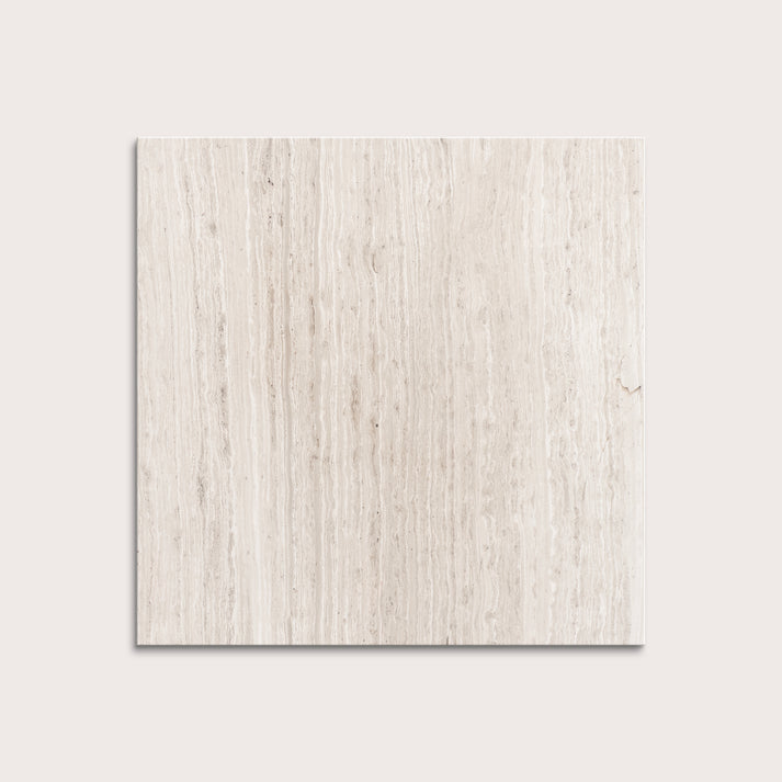 Beige limestone tile on a light gray background
