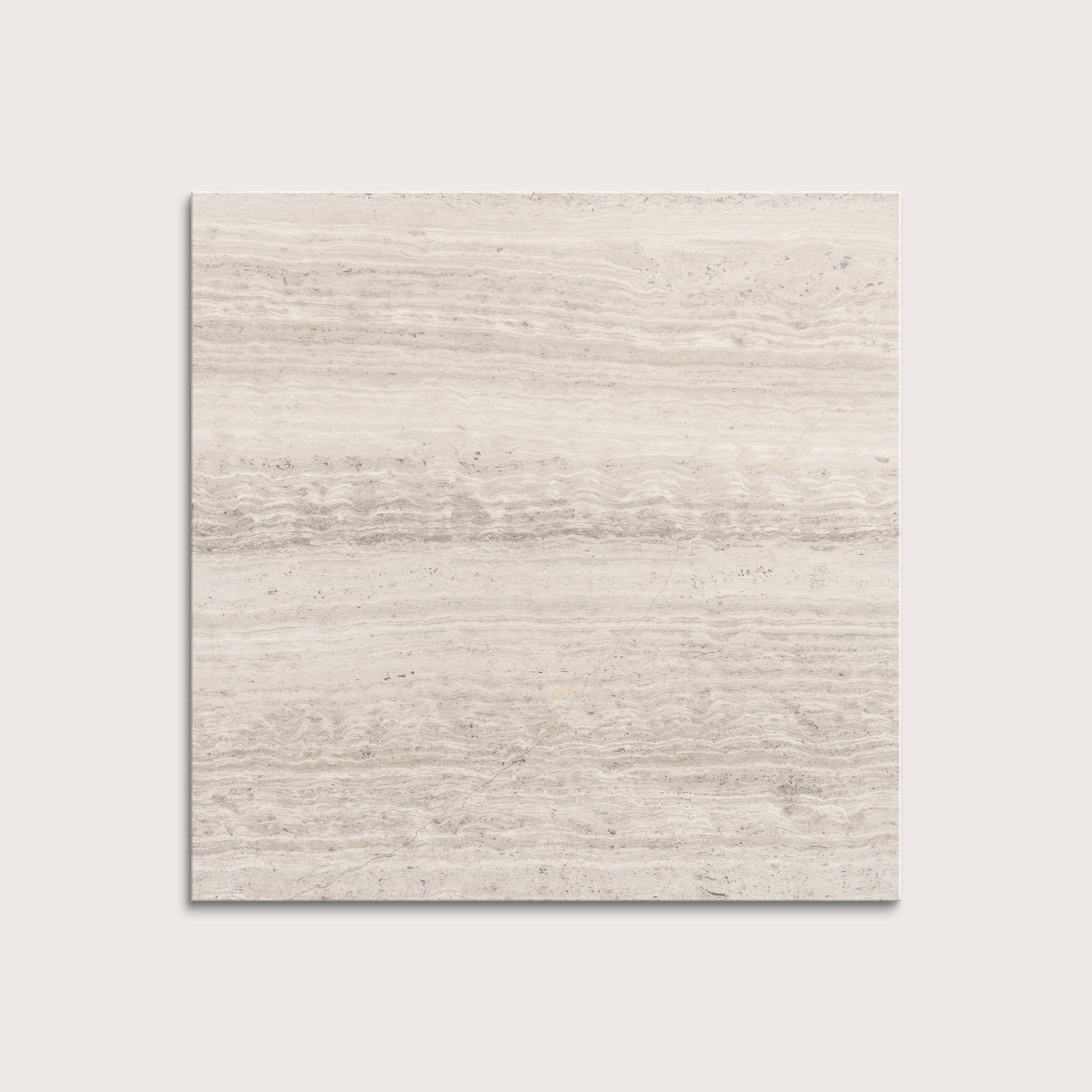 Beige limestone tile on a light gray background