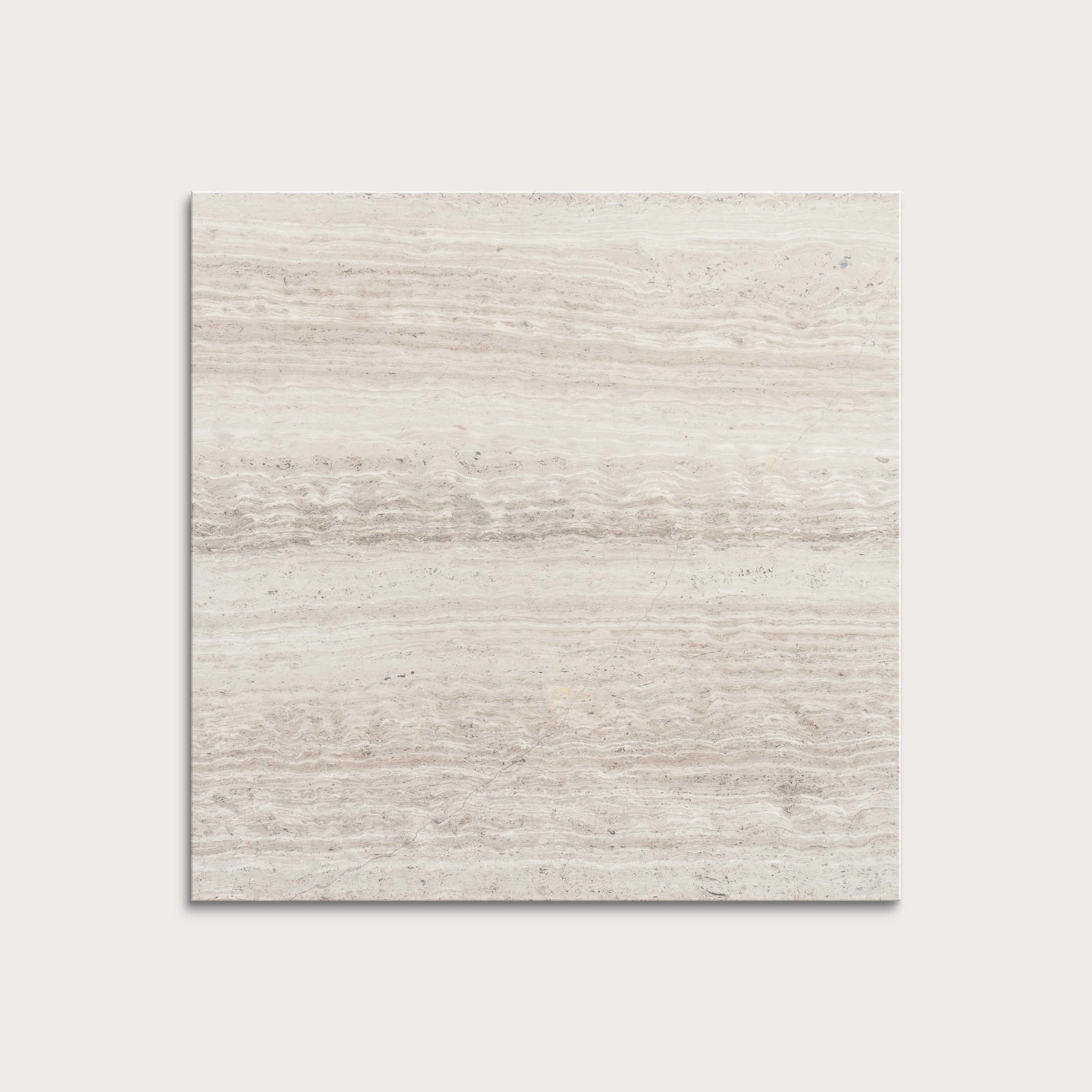 Beige limestone tile on a light gray background
