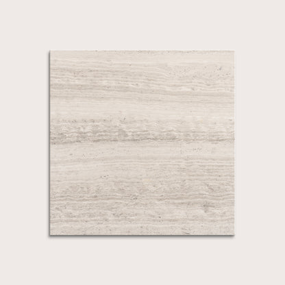 Beige limestone tile on a light gray background