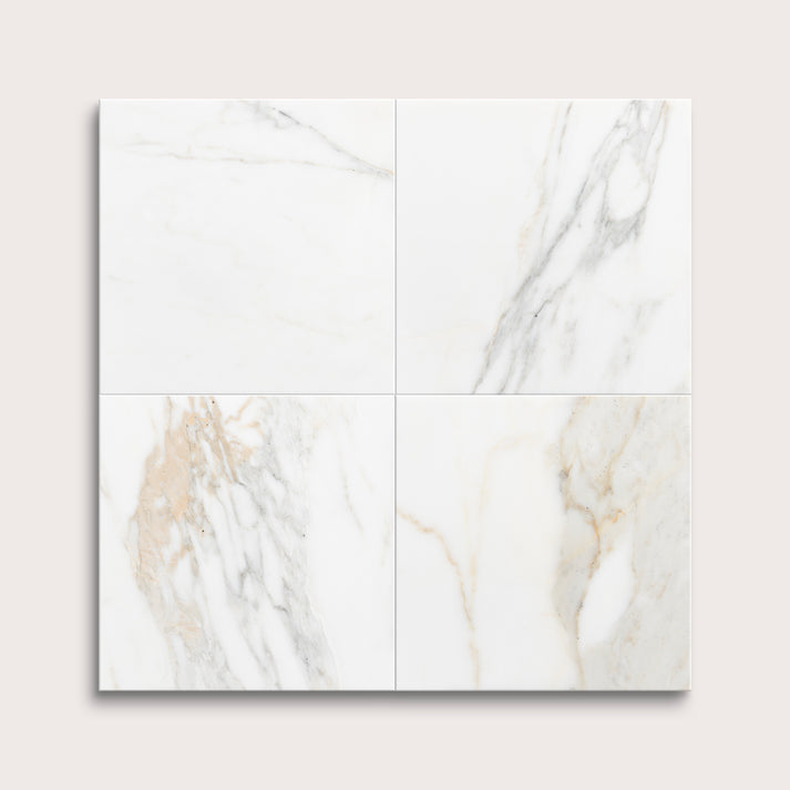 calacatta gold Marble tiles arranged in a grid on a light gray background