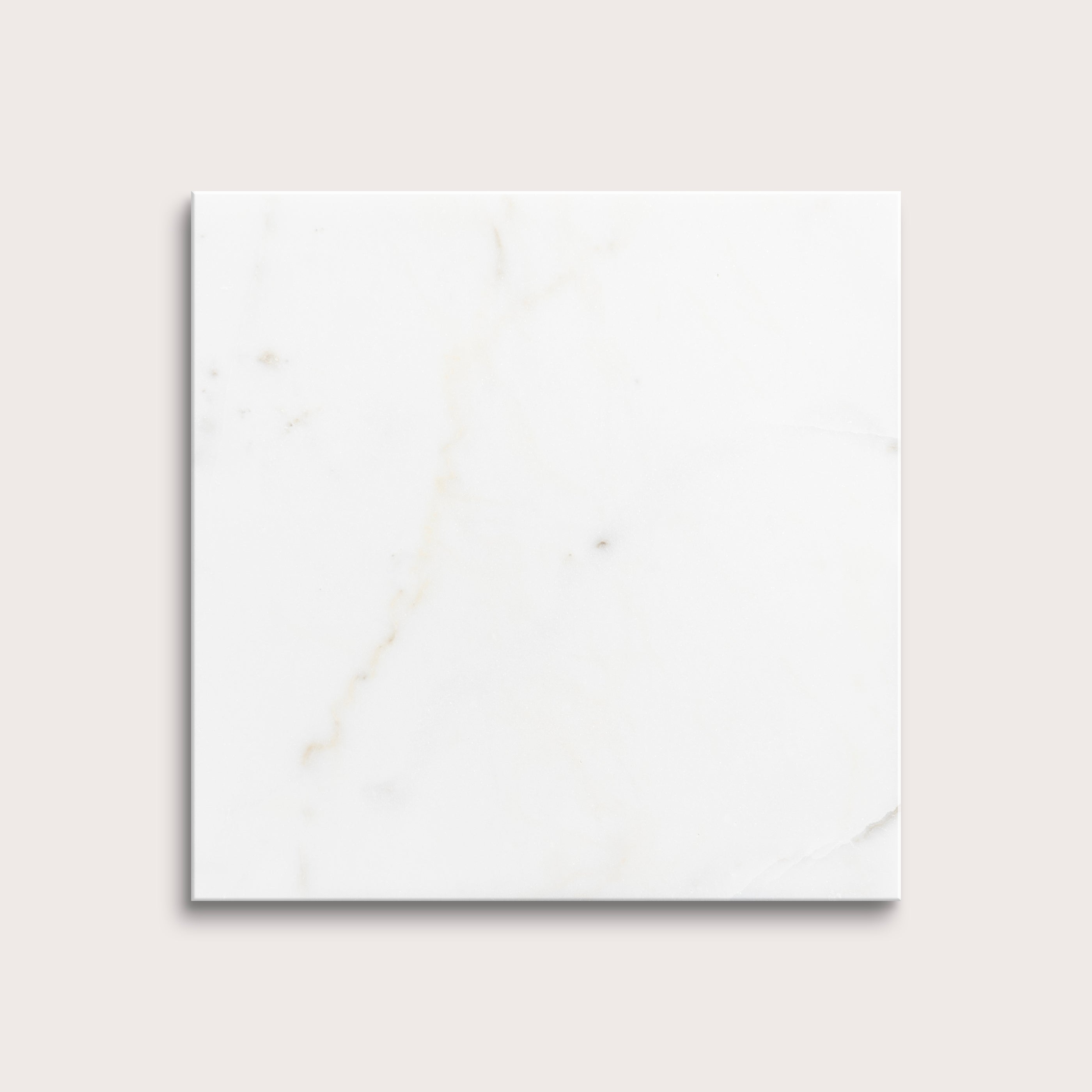 calacatta gold Marble tiles on a light gray background