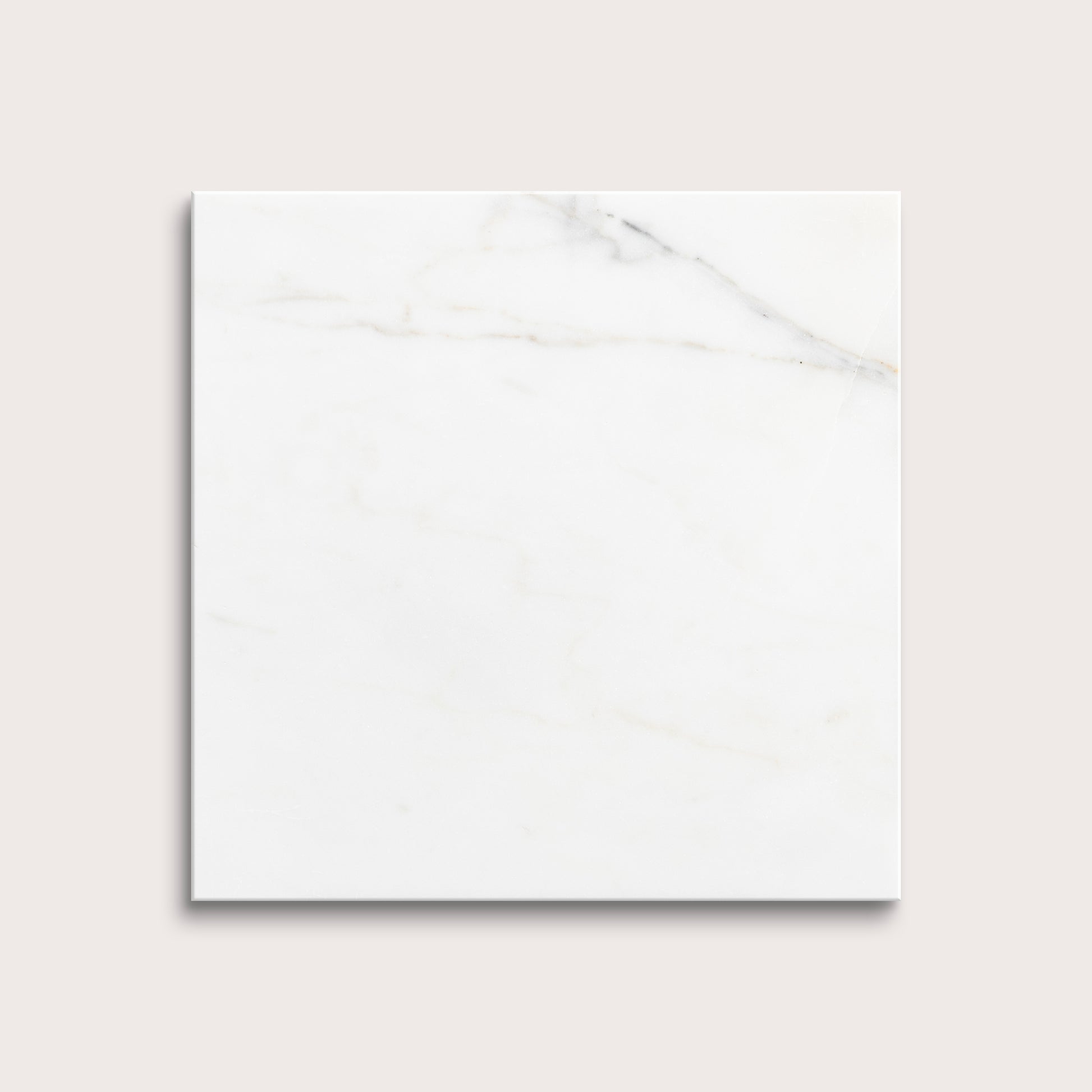 calacatta gold Marble tiles on a light gray background