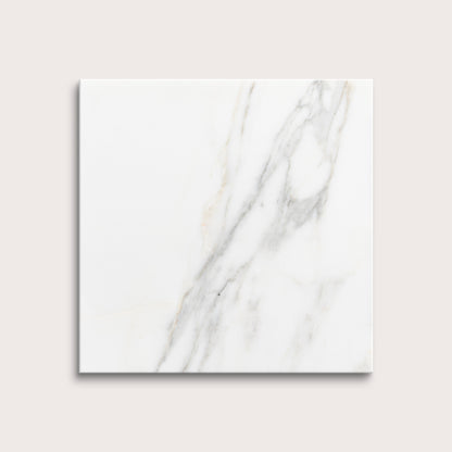 calacatta gold Marble tiles on a light gray background