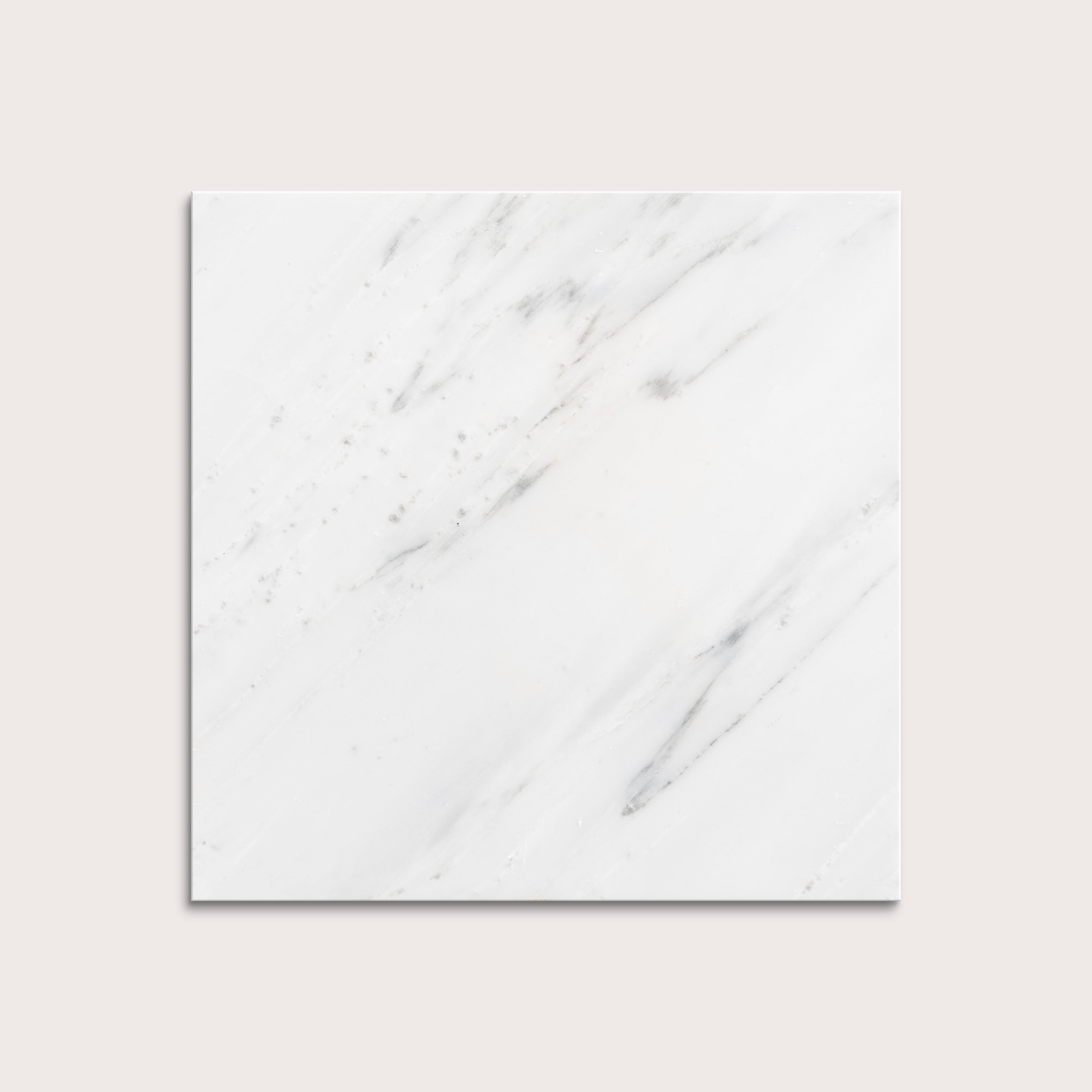 White casablanca carrara marble tiles on a light gray background