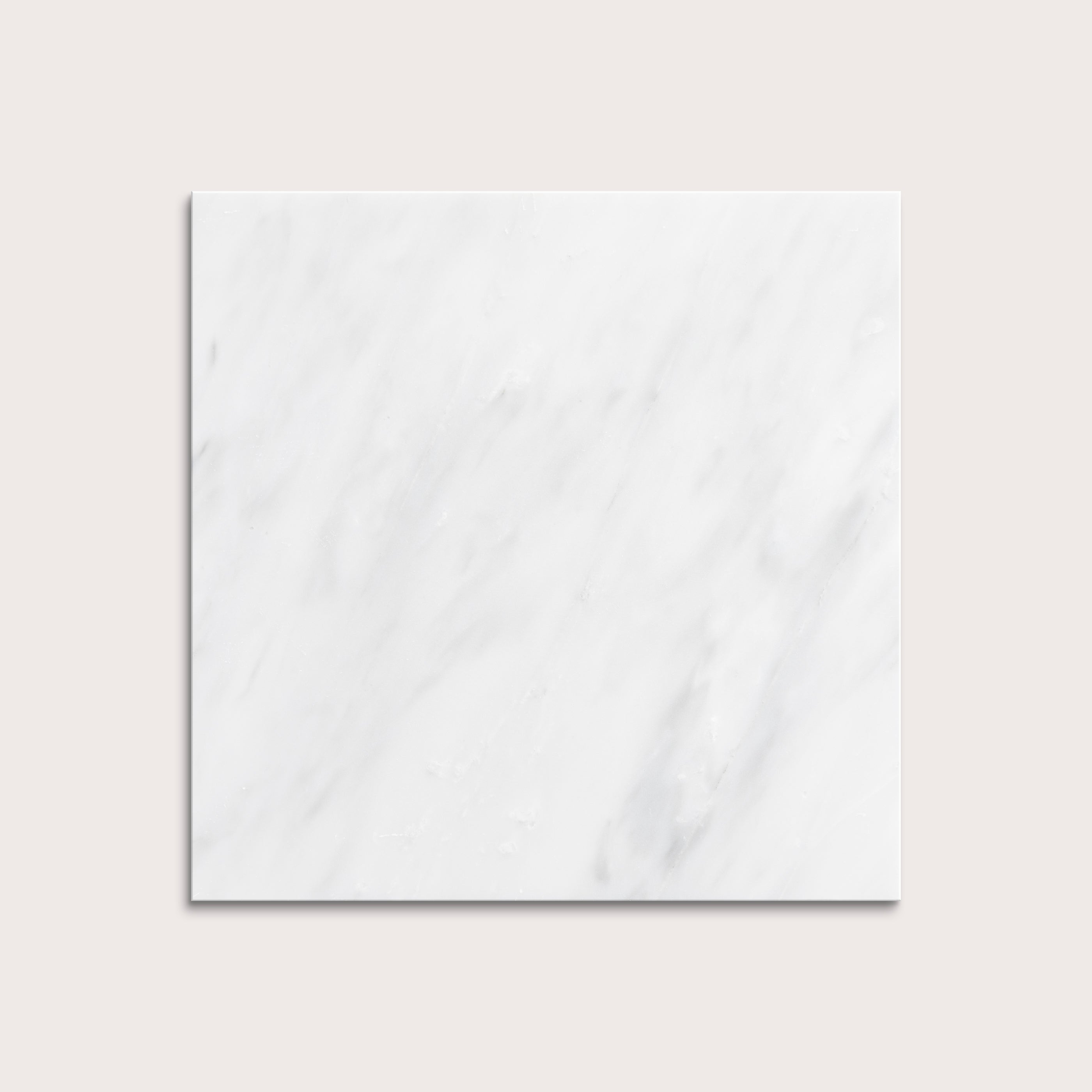 White casablanca carrara marble tiles on a light gray background