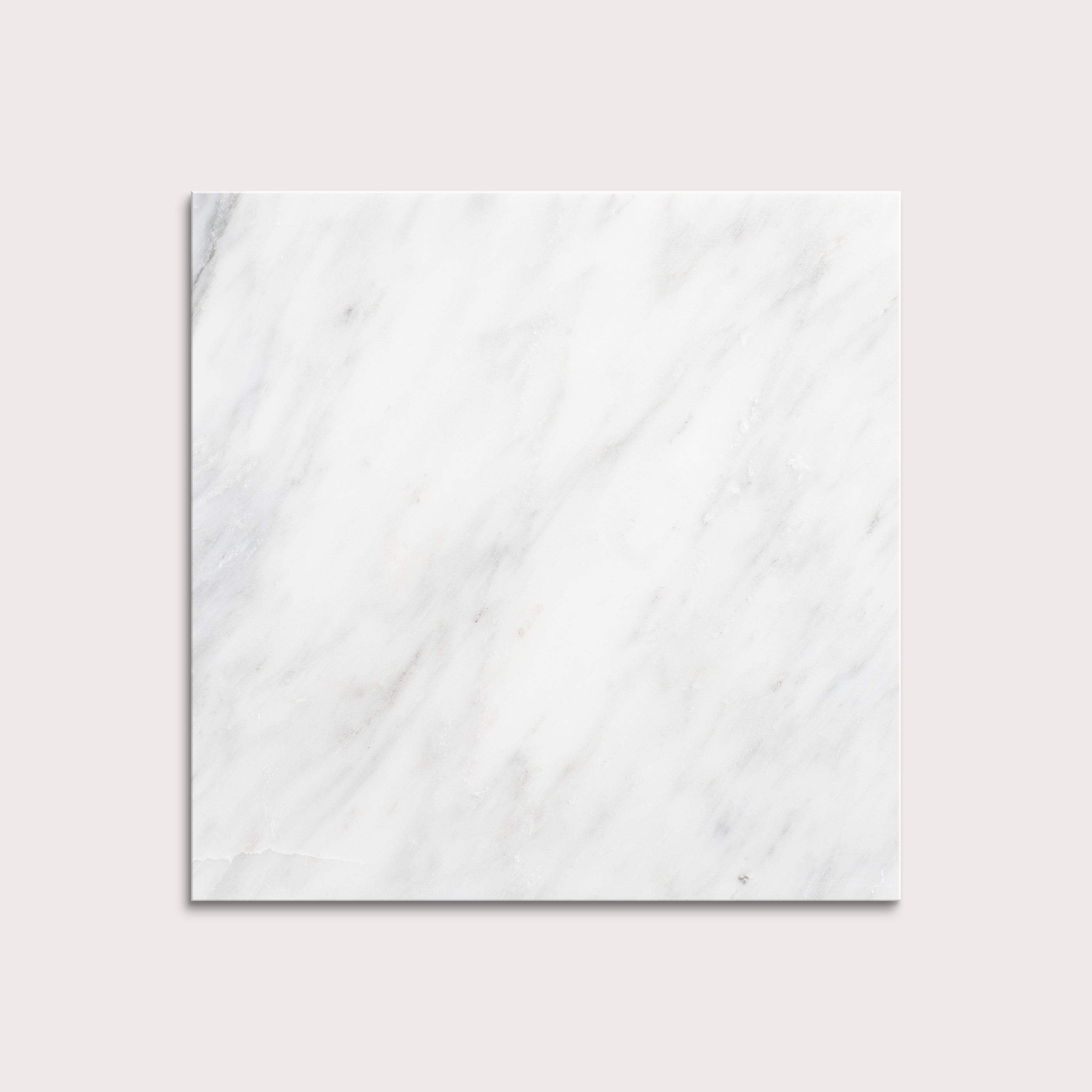 White casablanca carrara marble tiles on a light gray background