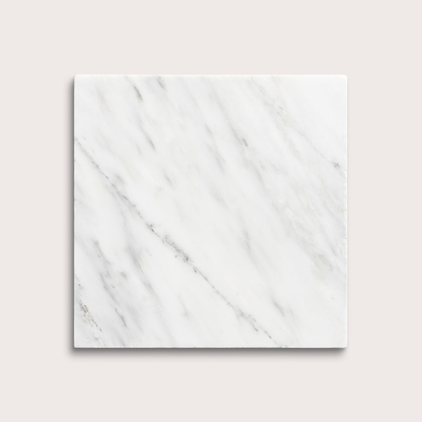 White casablanca carrara marble tiles on a light gray background