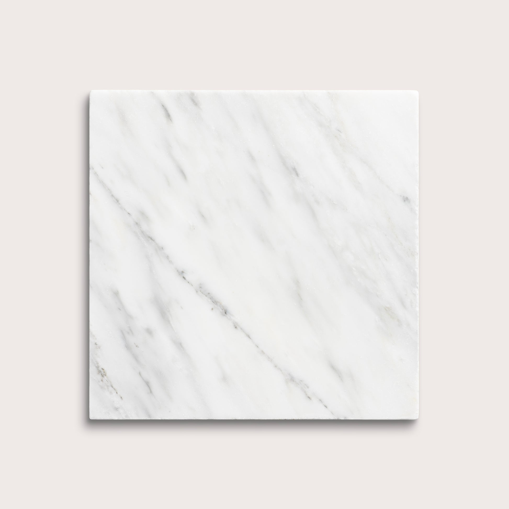 White casablanca carrara marble tiles on a light gray background