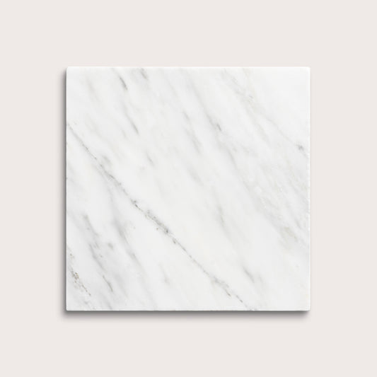 White casablanca carrara marble tiles on a light gray background