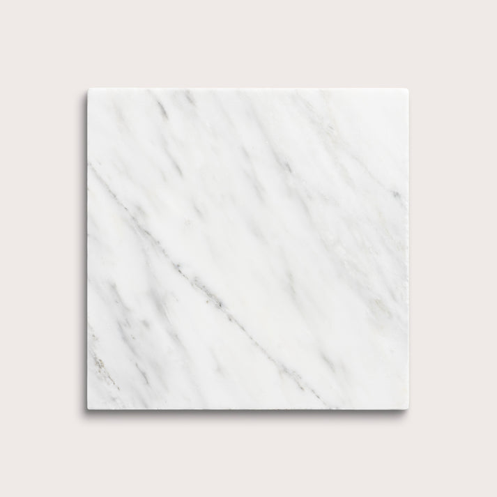 White casablanca carrara marble tiles on a light gray background