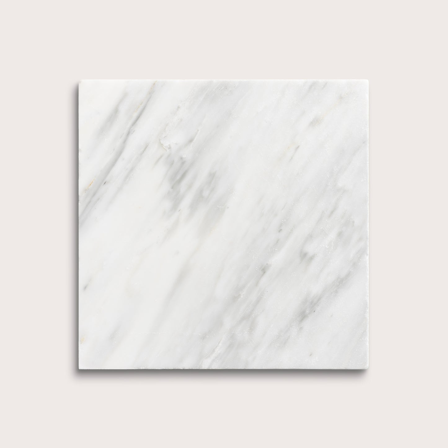 White casablanca carrara marble tiles on a light gray background