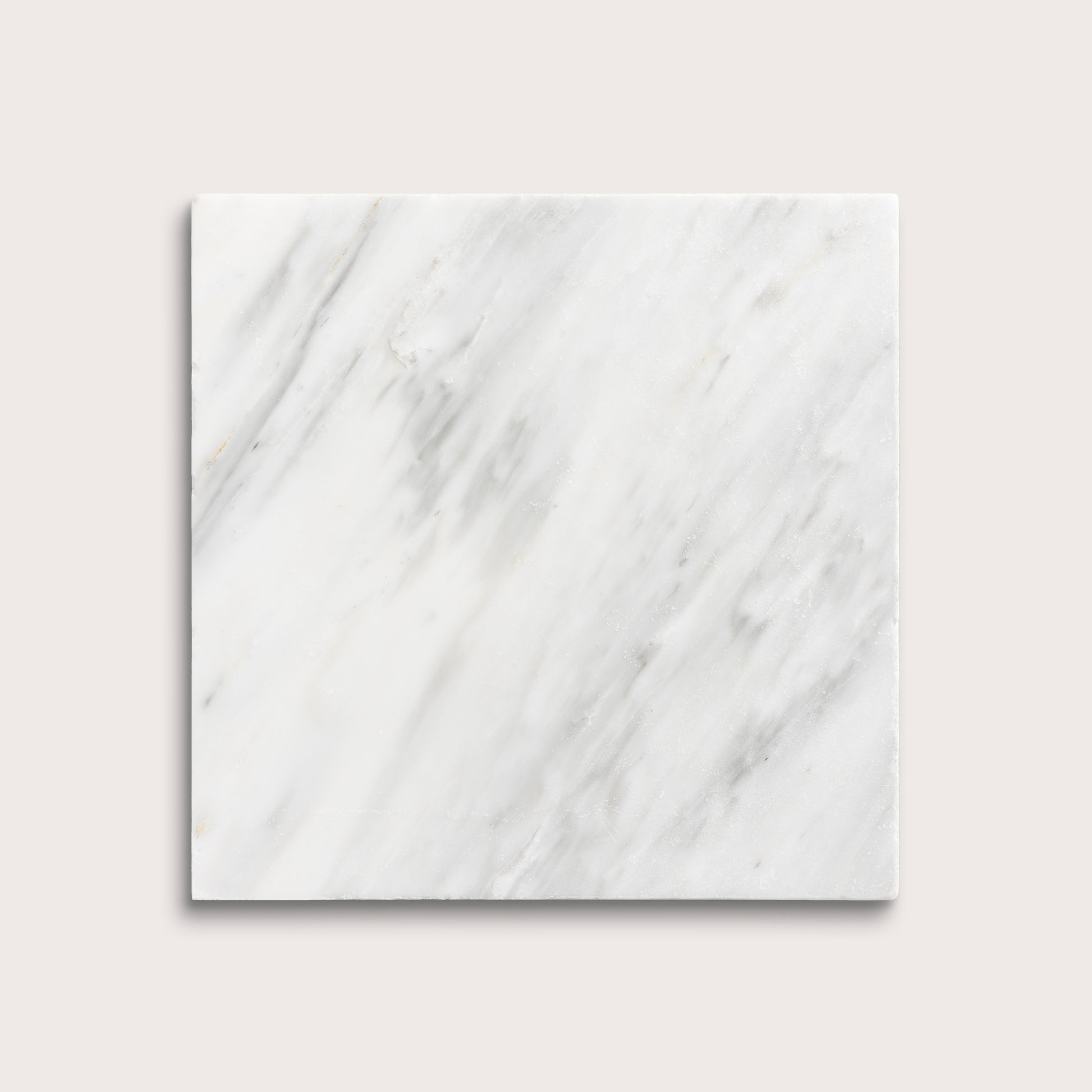 White casablanca carrara marble tiles on a light gray background