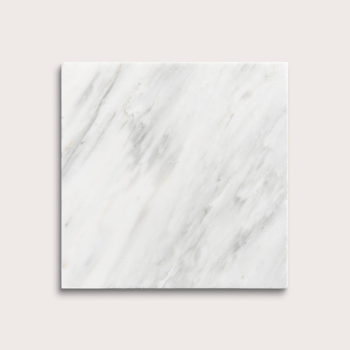 White casablanca carrara marble tiles on a light gray background