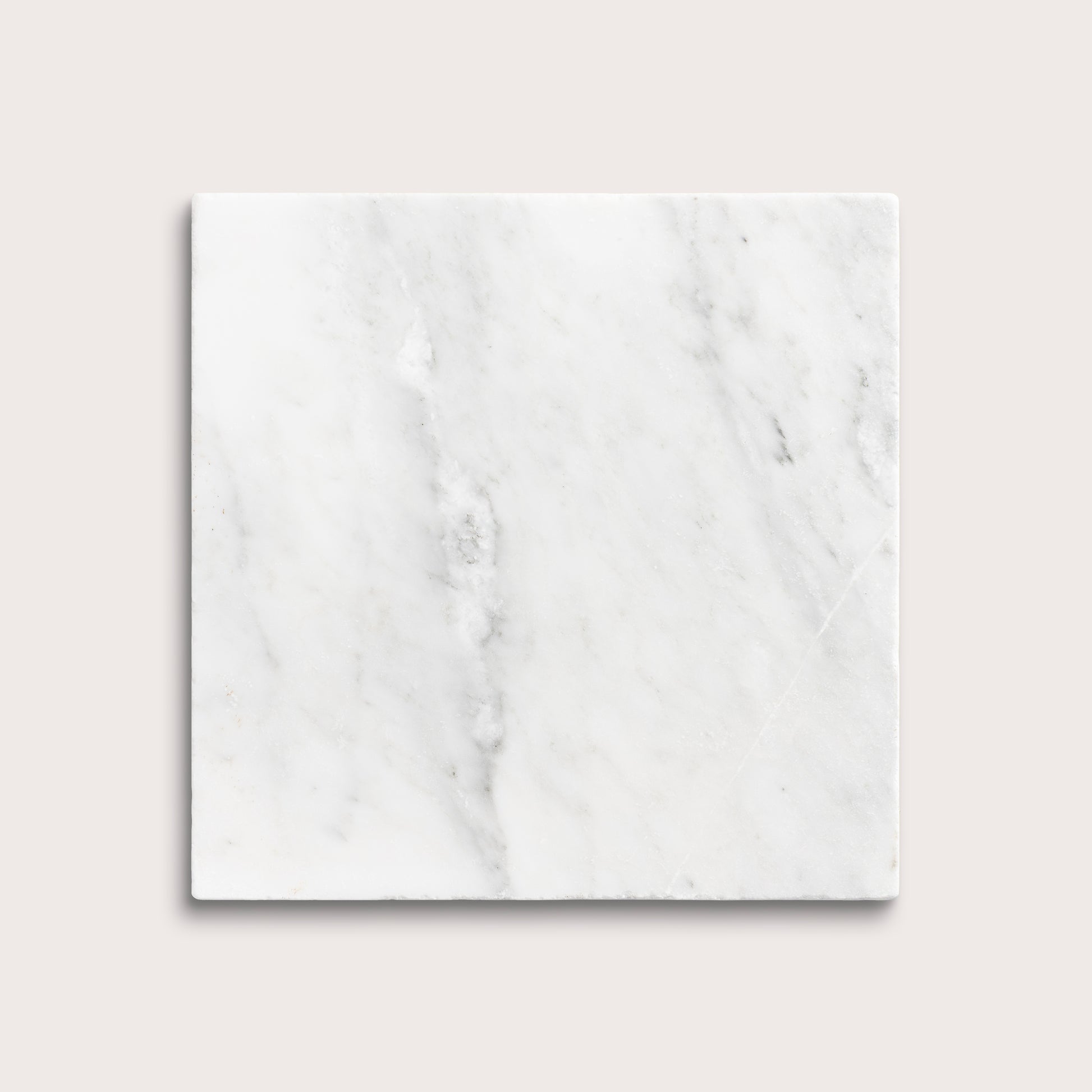 White casablanca carrara marble tiles on a light gray background