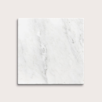 White casablanca carrara marble tiles on a light gray background