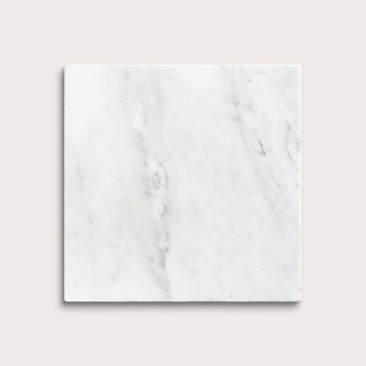 White casablanca carrara marble tiles on a light gray background
