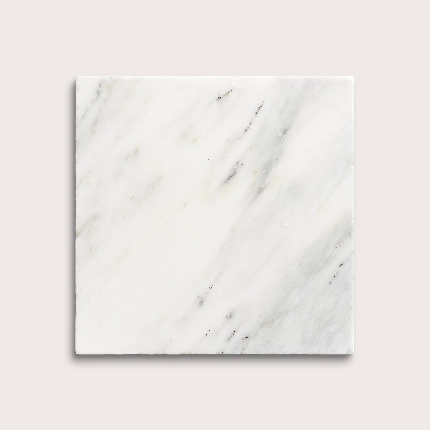 White casablanca carrara marble tiles on a light gray background