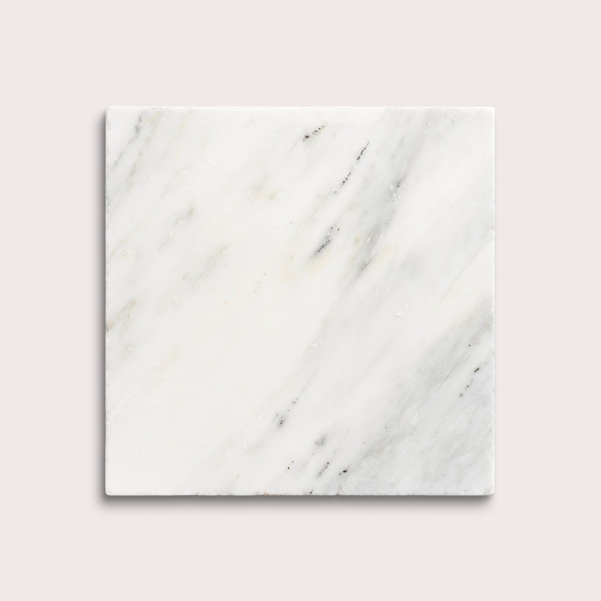 White casablanca carrara marble tiles on a light gray background