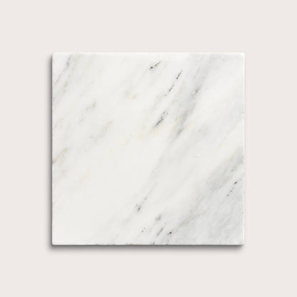 White casablanca carrara marble tiles on a light gray background