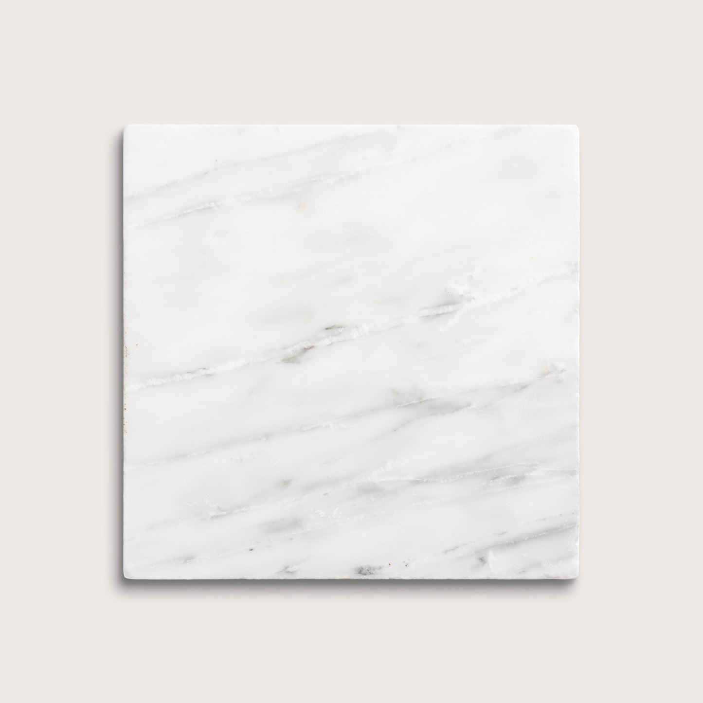 White casablanca carrara marble tiles on a light gray background